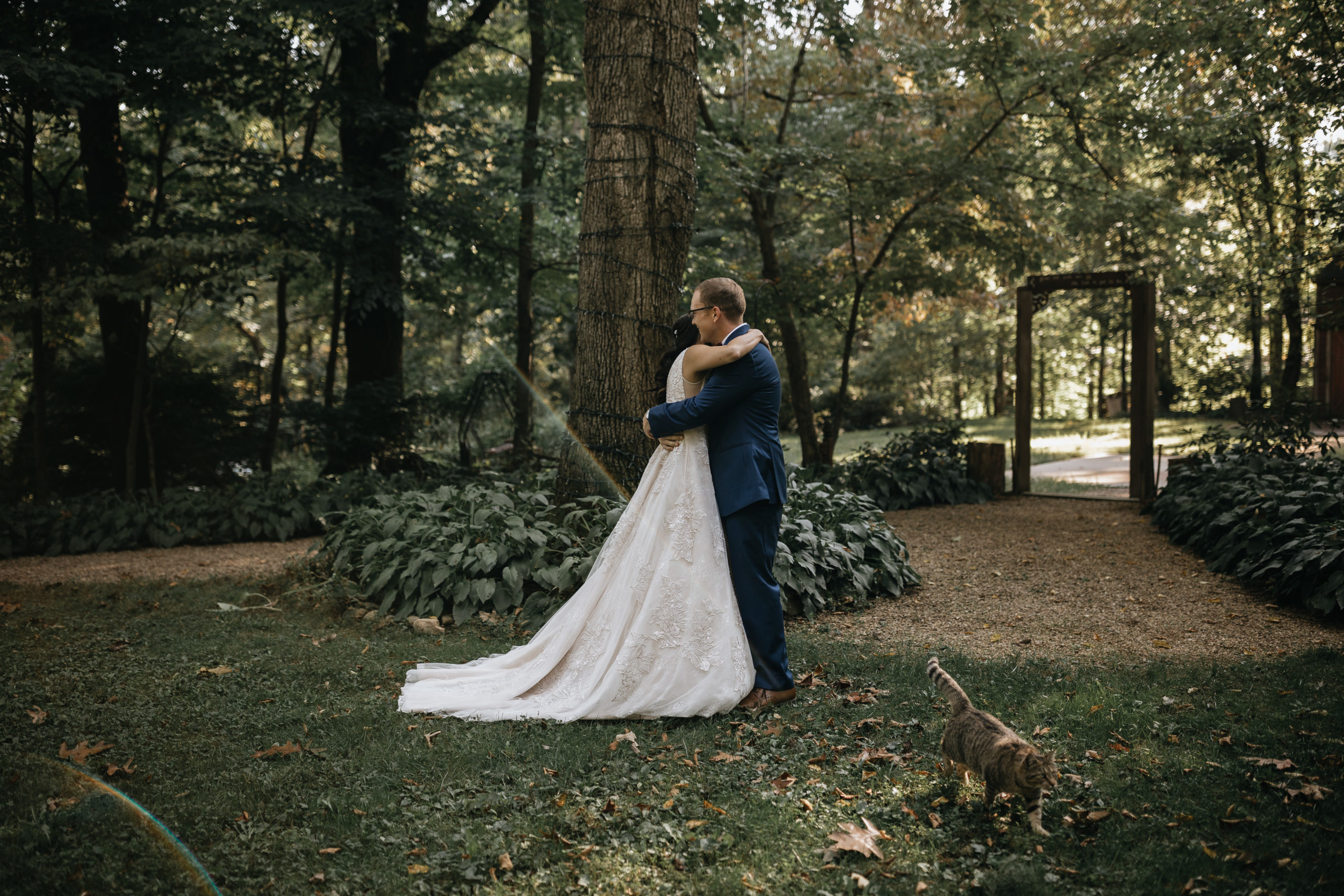 bride and groom hug on their wedding day during their first look at storybrook farms