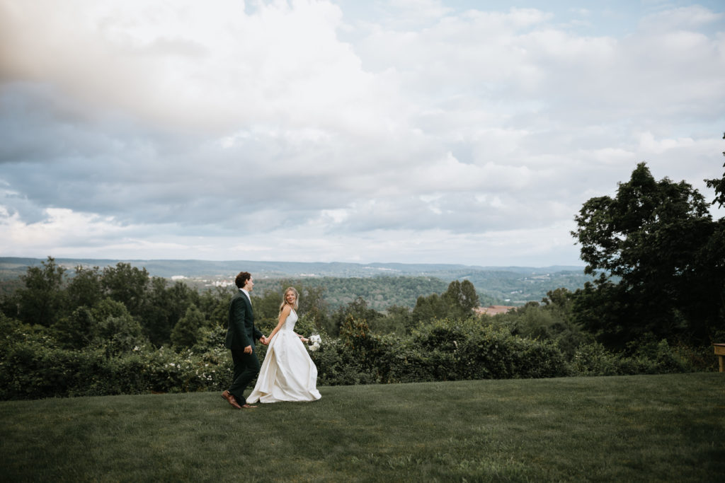 bride and groom portraits in front of a mountain view