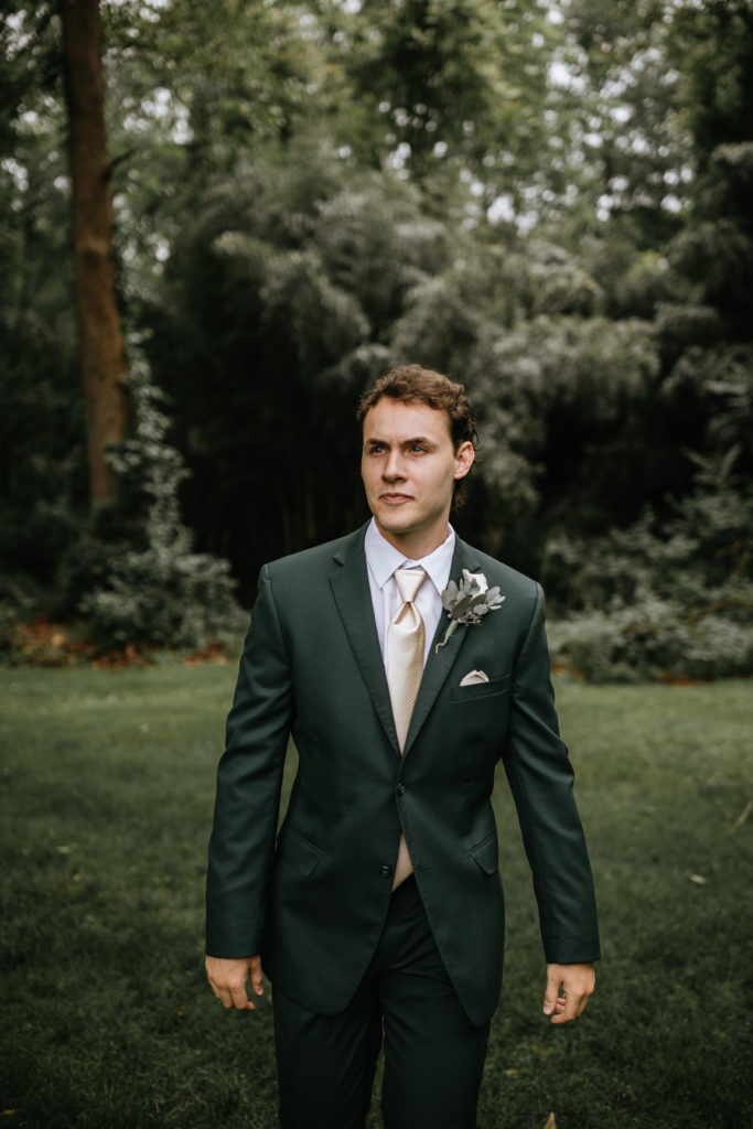 groom standing in forest at Morgantown Wedding 