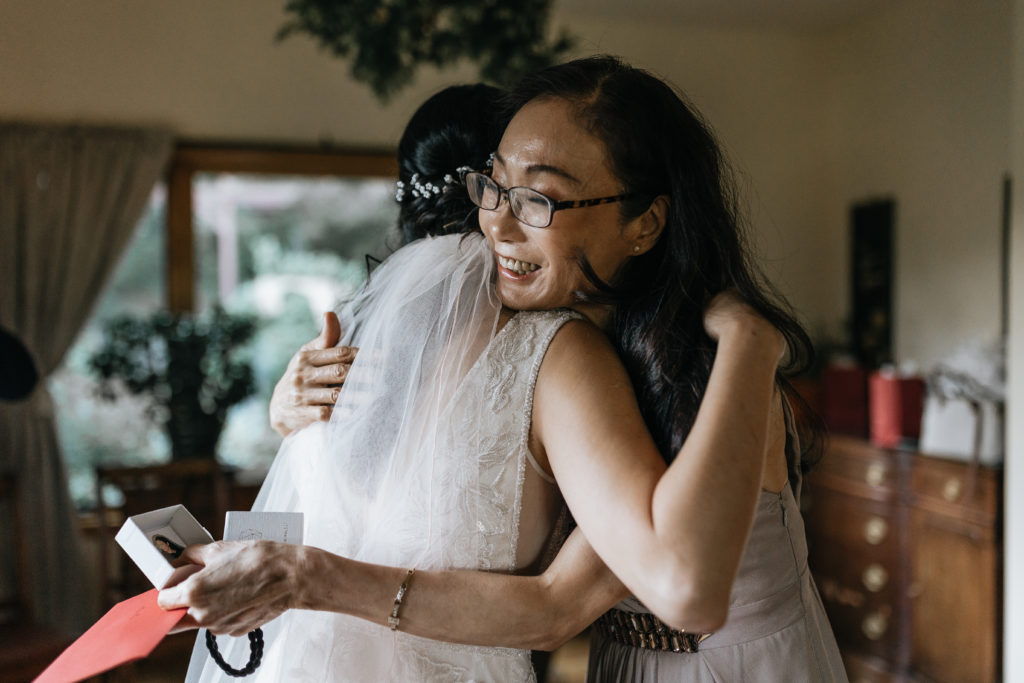 Bride hugging mom