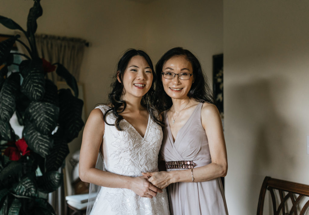 Bride and mom smiling