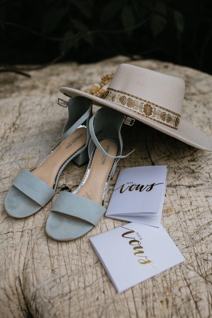 bride heels and hat and vow books