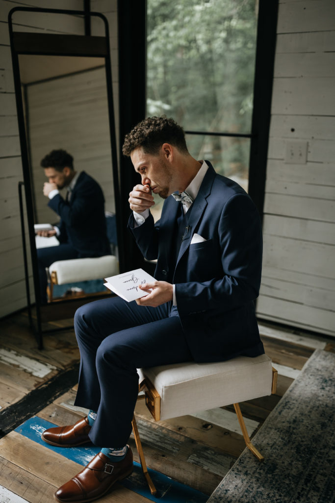 groom crying reading letter