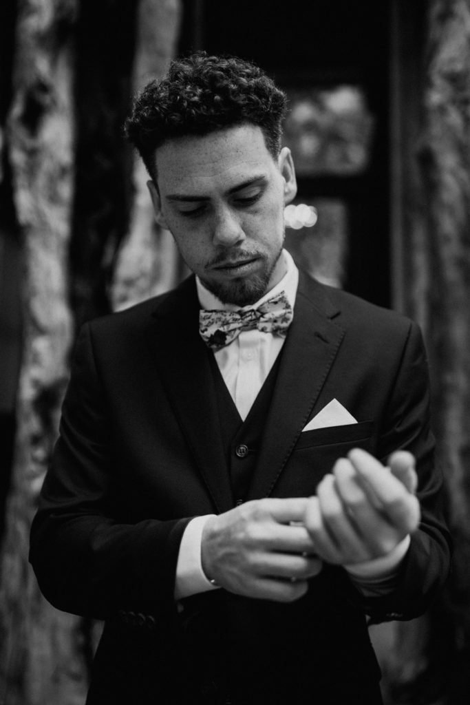 black and white photo of groom