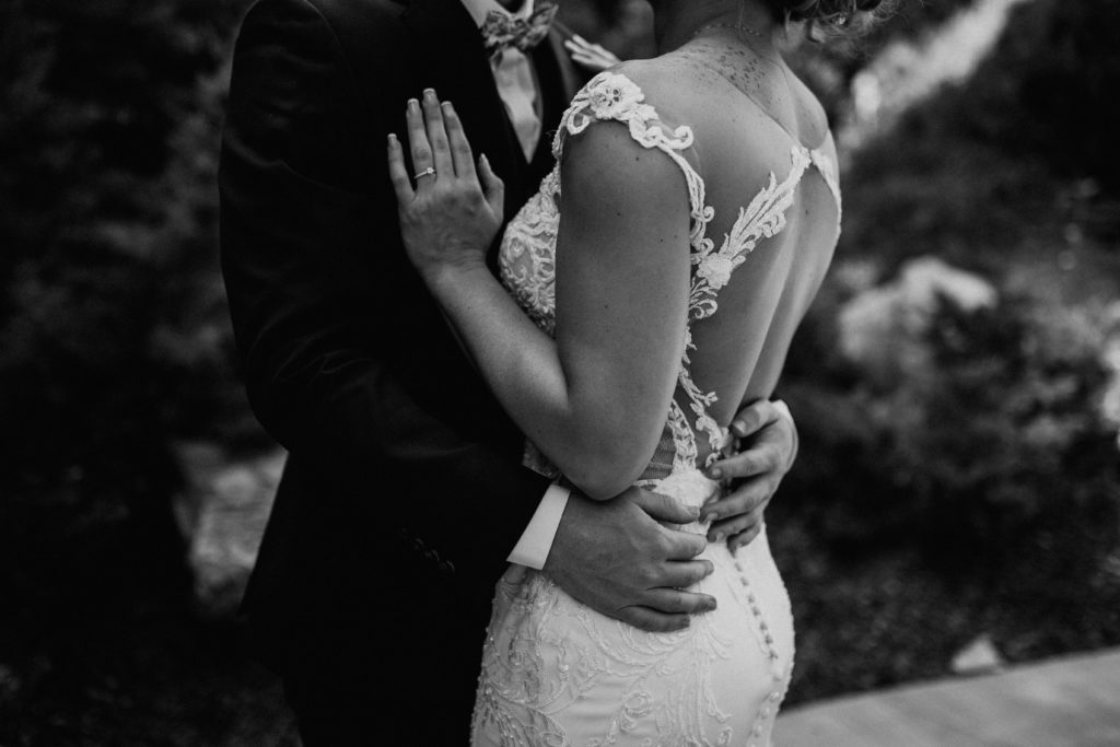 black and white detail photo of bride and groom