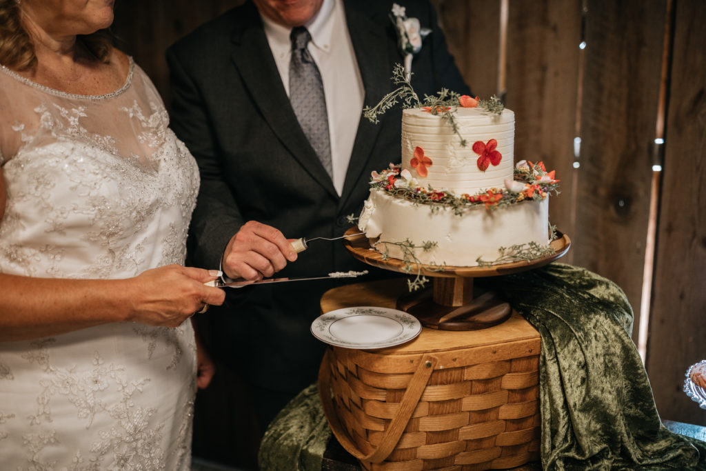 bride and groom cutting cake