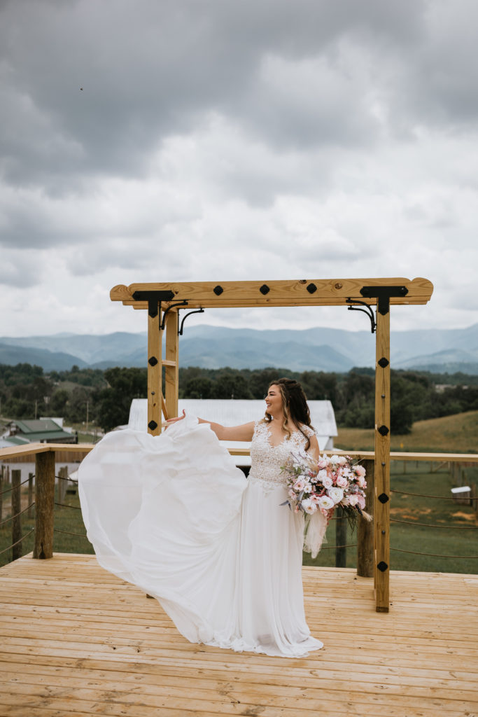 bride flowing dress up in air