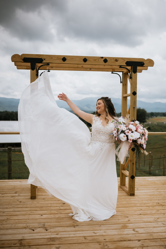bride flowing dress up in the air