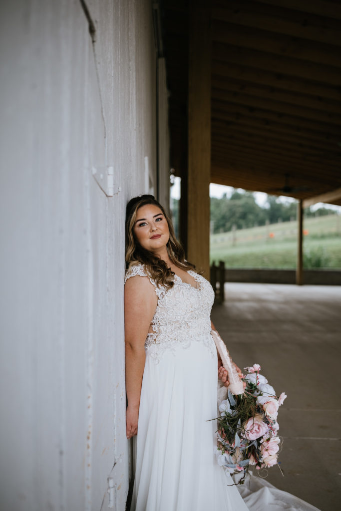 bride leaning against wall 