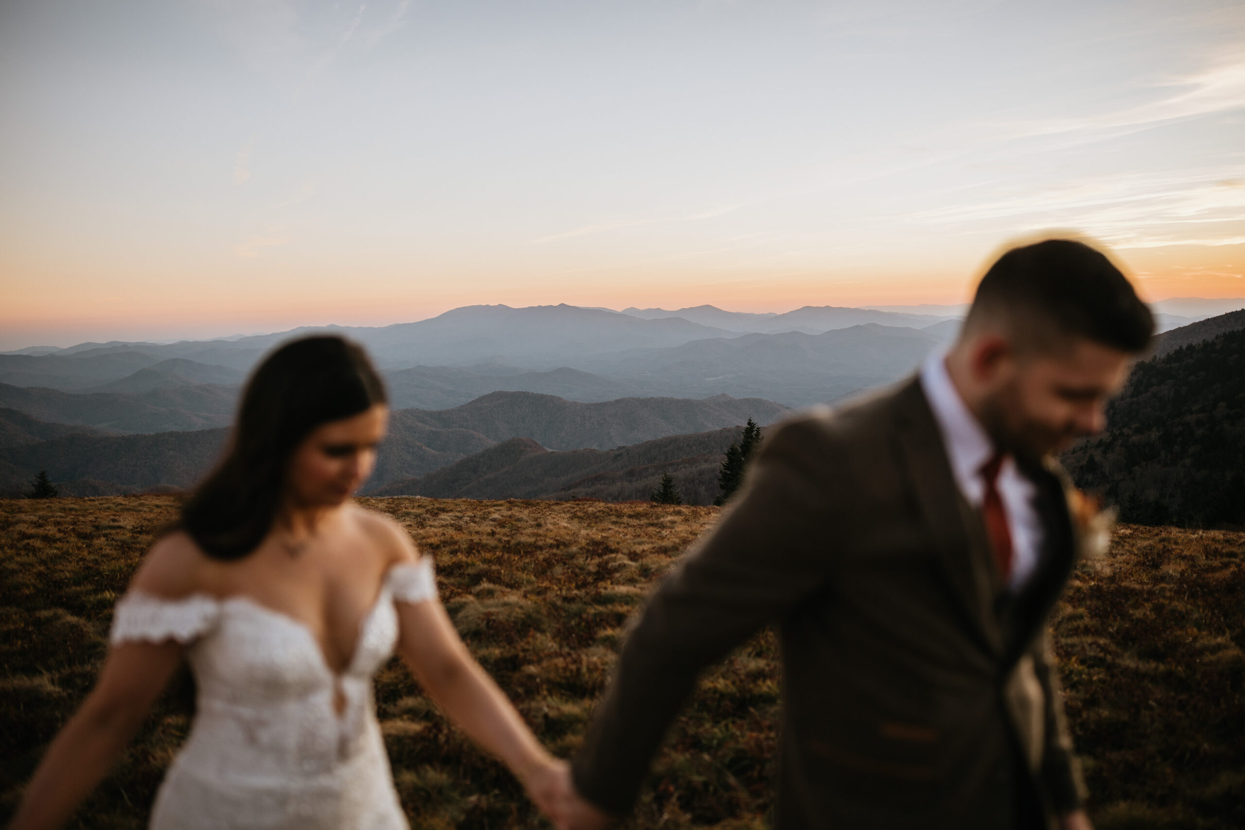 bride and groom blurred in the foreground in a picture of beautiful roan mountain tennessee mountains